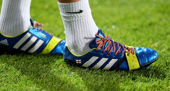Joey Barton of QPR wears rainbow-coloured shoe laces as part of a campaign against homophobia in football during the Sky Bet Championship match between Queens Park Rangers and Brighton & Hove Albion at Loftus Road on September 18, 2013 in London, England. (Getty Images)
